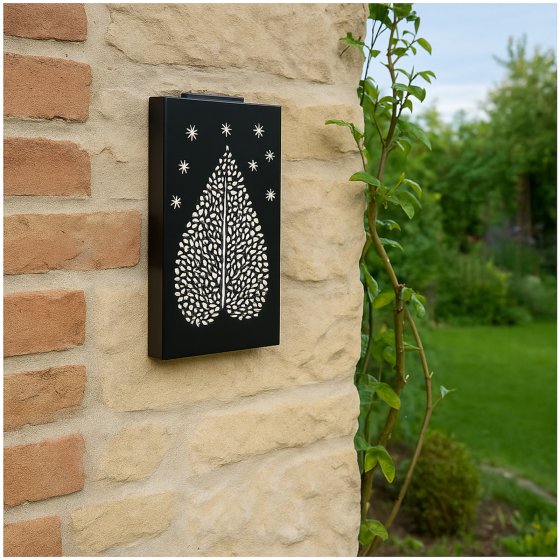Wandleuchte aus Metall mit Schattenspiel Blattmotiv 