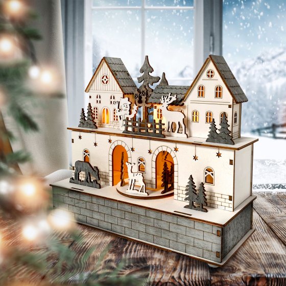 Beleuchtete Weihnachtsszene mit beweglichen Figuren